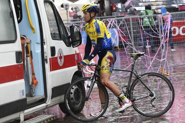 Roche seeks medical attention after coming down towards the end of the stage