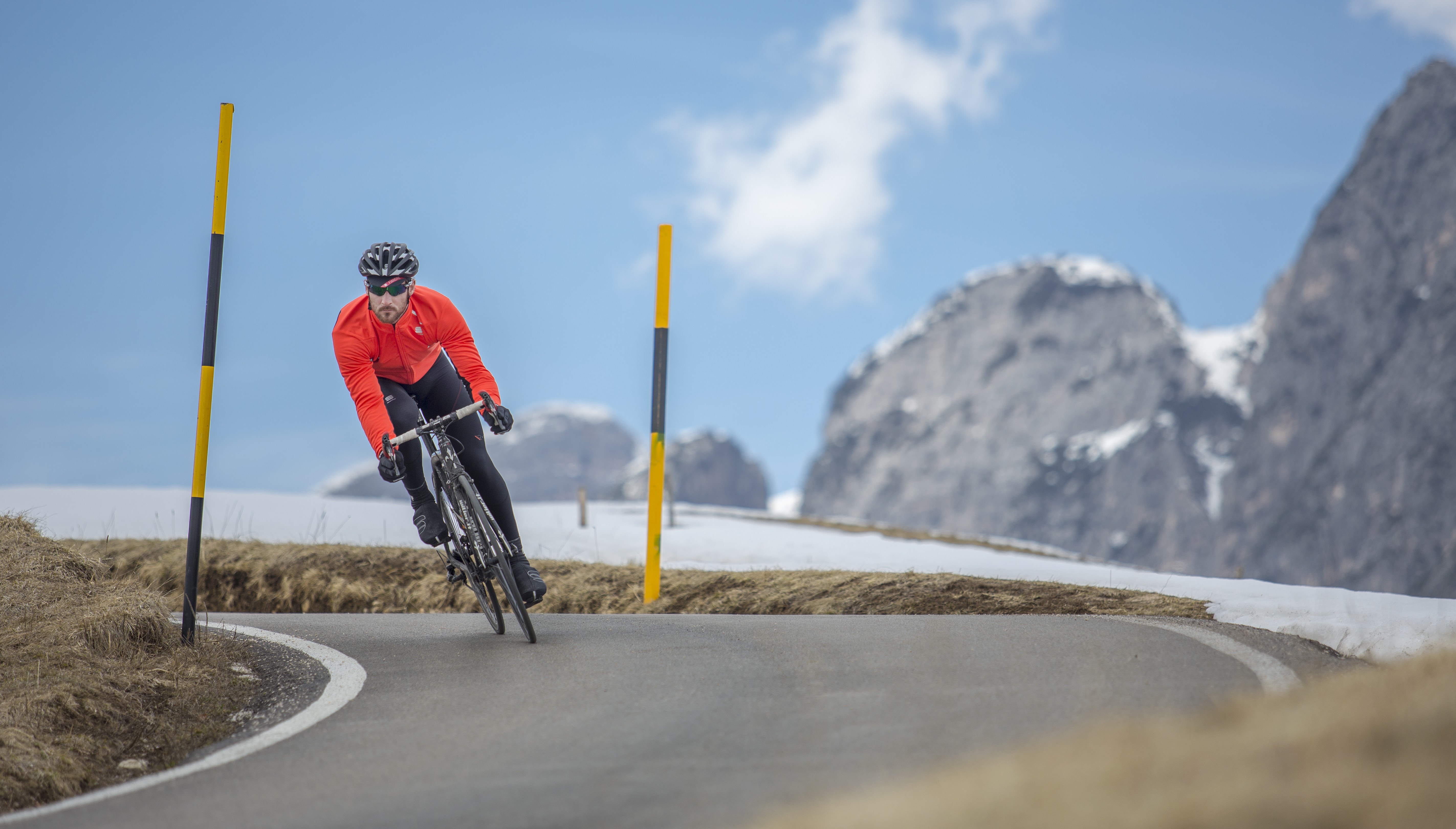 Michele high in the Dolomites wearing R&D Zero Jacket & Bibtights with Sottozero gloves and WS Reflex Booties